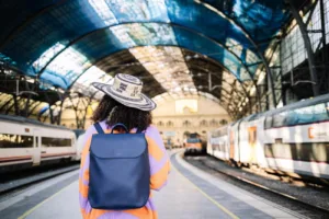 female traveler waiting for train on platform 2023 11 27 05 28 59 utc